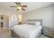 Cozy bedroom featuring neutral décor, a ceiling fan, and easy access to the en-suite bathroom at 830 E Garden Basket Dr, Queen Creek, AZ 85140