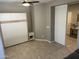 Another view of a bedroom showcasing tile flooring, neutral tones, and a built-in Murphy bed at 830 E Garden Basket Dr, Queen Creek, AZ 85140