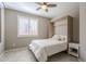 Cozy bedroom features a stylish Murphy bed, ceiling fan, and bright natural light at 830 E Garden Basket Dr, Queen Creek, AZ 85140