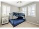 bedroom with a bunk bed, a ceiling fan, and windows with white blinds at 830 E Garden Basket Dr, Queen Creek, AZ 85140