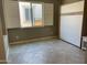Bright bedroom featuring tile flooring, neutral paint, and a modern Murphy bed for versatile space utilization at 830 E Garden Basket Dr, Queen Creek, AZ 85140