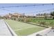 Well-maintained bocce ball court with a lush green landscape for leisurely outdoor activities at 830 E Garden Basket Dr, Queen Creek, AZ 85140