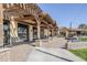Attractive outdoor lounge area with comfortable seating outside the community clubhouse at 830 E Garden Basket Dr, Queen Creek, AZ 85140