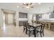 Spacious dining room with tile floors that opens up into the kitchen at 830 E Garden Basket Dr, Queen Creek, AZ 85140