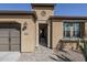 Inviting front entrance featuring a brick pathway and decorative architectural details at 830 E Garden Basket Dr, Queen Creek, AZ 85140