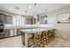 Modern kitchen featuring a breakfast bar with seating and pendant lighting at 830 E Garden Basket Dr, Queen Creek, AZ 85140