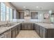 Modern kitchen with granite countertops, stainless steel appliances, and ample cabinet space at 830 E Garden Basket Dr, Queen Creek, AZ 85140
