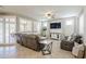 Inviting living room with a large window, comfortable seating, and a ceiling fan at 830 E Garden Basket Dr, Queen Creek, AZ 85140