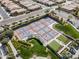 Aerial view of community pickleball courts surrounded by green spaces, ideal for active living at 830 E Garden Basket Dr, Queen Creek, AZ 85140