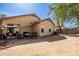 Spacious backyard with a patio area, ready for outdoor entertaining and relaxation in the desert sun at 8520 E Laguna Azul Ave, Mesa, AZ 85209