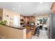 Well-equipped kitchen with stainless steel appliances and a large island with seating at 8520 E Laguna Azul Ave, Mesa, AZ 85209