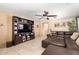 Inviting living room with tile floors, a media center and a comfortable sectional sofa at 8520 E Laguna Azul Ave, Mesa, AZ 85209