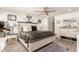 Bright main bedroom featuring a ceiling fan, lots of natural light, and ample space at 8520 E Laguna Azul Ave, Mesa, AZ 85209