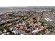 Expansive aerial of a community with red tile roofs, mature trees, convenient parking, and a tranquil swimming pool at 9710 N 94Th Pl # 216, Scottsdale, AZ 85258