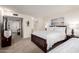 Spacious bedroom with a queen bed, daybed, soft carpet, and art on the wall at 9710 N 94Th Pl # 216, Scottsdale, AZ 85258