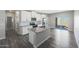 Bright kitchen featuring white cabinets, granite countertops, and stainless steel appliances at 10329 N 115Th Ave, Youngtown, AZ 85363