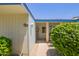 Inviting front entrance featuring a charming walkway and well-maintained landscaping at 10859 W Coggins Dr, Sun City, AZ 85351