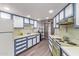 Bright kitchen with vintage appliances, ample counter space, and updated flooring at 10859 W Coggins Dr, Sun City, AZ 85351