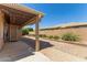 Inviting backyard patio featuring a pergola and landscaping at 10918 E Oro Ave, Mesa, AZ 85212