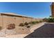 Paver patio and block wall define the backyard of this property with desert landscaping at 10918 E Oro Ave, Mesa, AZ 85212