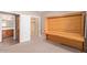 Bedroom with a murphy bed and a closet featuring built-in shelving and cabinetry at 10918 E Oro Ave, Mesa, AZ 85212