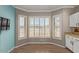 Cozy breakfast nook features white shutters and wood flooring at 10918 E Oro Ave, Mesa, AZ 85212