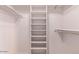 Walk-in closet with built-in shelving and hanging rods for maximum storage at 10918 E Oro Ave, Mesa, AZ 85212