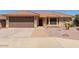 Single-story home featuring a well-maintained front yard and an attached two-car garage at 10918 E Oro Ave, Mesa, AZ 85212