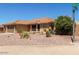Lovely single-story home featuring desert landscaping, a tile roof and an attached two-car garage at 10918 E Oro Ave, Mesa, AZ 85212