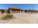Single-story home featuring a well-maintained front yard with drought-tolerant landscaping at 10918 E Oro Ave, Mesa, AZ 85212