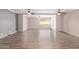 Bright, open living room with hardwood floors, ceiling fans and plenty of natural light at 10918 E Oro Ave, Mesa, AZ 85212