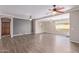 Spacious, open living room featuring hardwood floors, modern paint colors and an open floor plan at 10918 E Oro Ave, Mesa, AZ 85212