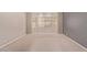 Spacious bedroom offers a large bay window, neutral carpet, and ample lighting at 10918 E Oro Ave, Mesa, AZ 85212