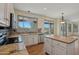 Bright kitchen featuring stainless appliances, granite countertops, and a functional wooden island at 11263 S Oakwood Dr, Goodyear, AZ 85338