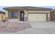 Charming single-story home featuring a two-car garage, stone accents, and low-maintenance desert landscaping at 11522 W Deanne Dr, Youngtown, AZ 85363