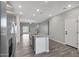 Bright kitchen features stainless steel appliances and a view into the living room at 11522 W Deanne Dr, Youngtown, AZ 85363