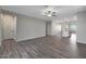 Open living room with a view into the kitchen at 11522 W Deanne Dr, Youngtown, AZ 85363