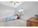 Cozy bedroom with a vaulted ceiling, plush carpet, and a large window at 1225 E Sea Gull Dr, Gilbert, AZ 85234