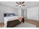 Bright bedroom featuring a ceiling fan, closet, and neutral color scheme for a relaxing atmosphere at 1225 E Sea Gull Dr, Gilbert, AZ 85234
