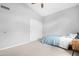 Vaulted ceiling bedroom with a large closet, plush carpet, and ceiling fan at 1225 E Sea Gull Dr, Gilbert, AZ 85234