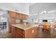 Open kitchen features stainless steel appliances, granite countertops, a kitchen island, and breakfast nook dining area at 1225 E Sea Gull Dr, Gilbert, AZ 85234