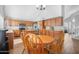 Bright open kitchen with an adjacent breakfast area, stainless appliances, granite counters, and ample storage space at 1225 E Sea Gull Dr, Gilbert, AZ 85234