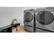 Laundry room with front loading washer and dryer, providing convenience and efficiency at 1225 E Sea Gull Dr, Gilbert, AZ 85234