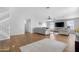 Spacious living room featuring neutral tones, a ceiling fan, and wood flooring at 1225 E Sea Gull Dr, Gilbert, AZ 85234