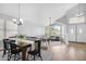 Bright living room with hardwood floors, high ceilings, and views into the dining area and front windows at 1225 E Sea Gull Dr, Gilbert, AZ 85234