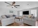 Comfortable living room with a ceiling fan, recessed lighting, and lots of space for entertaining at 1225 E Sea Gull Dr, Gilbert, AZ 85234