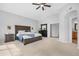 Spacious main bedroom featuring neutral colors and a ceiling fan at 1225 E Sea Gull Dr, Gilbert, AZ 85234