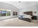 Main bedroom with a ceiling fan and large windows allowing natural light at 1225 E Sea Gull Dr, Gilbert, AZ 85234