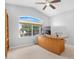 Bright office features a large window with views, vaulted ceiling, and ceiling fan at 1225 E Sea Gull Dr, Gilbert, AZ 85234
