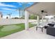 Covered patio includes a putting green and outdoor seating at 1225 E Sea Gull Dr, Gilbert, AZ 85234